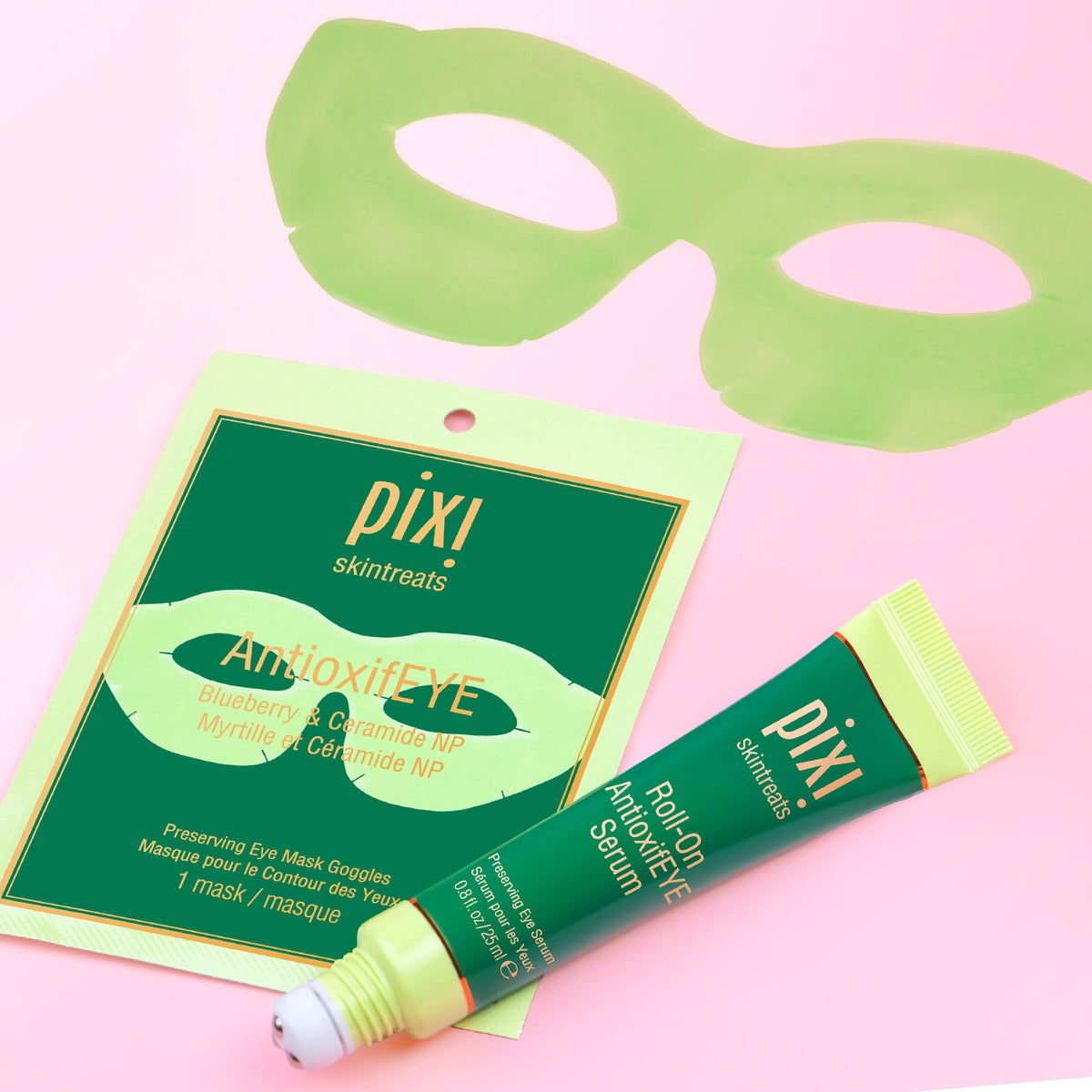 PIXI skincare products including AntioxifEYE Eye Mask Goggles and Roll-on AntioxifEYE serum on a pink background