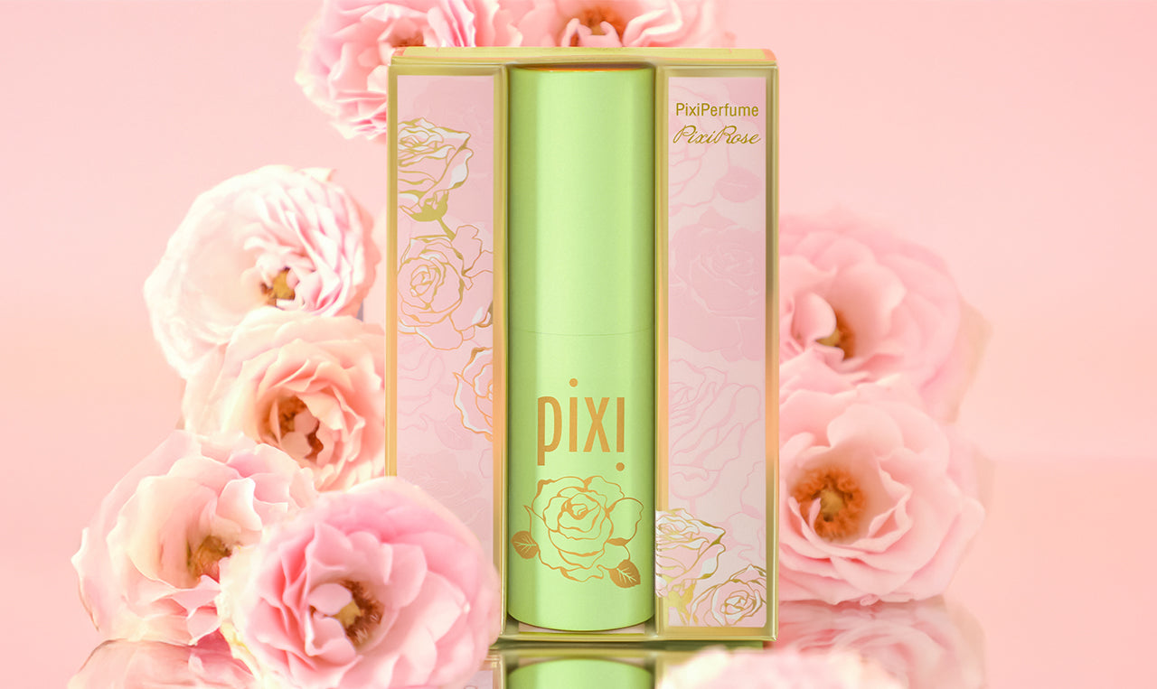 PixiPerfume PixiRose on a pink background with roses