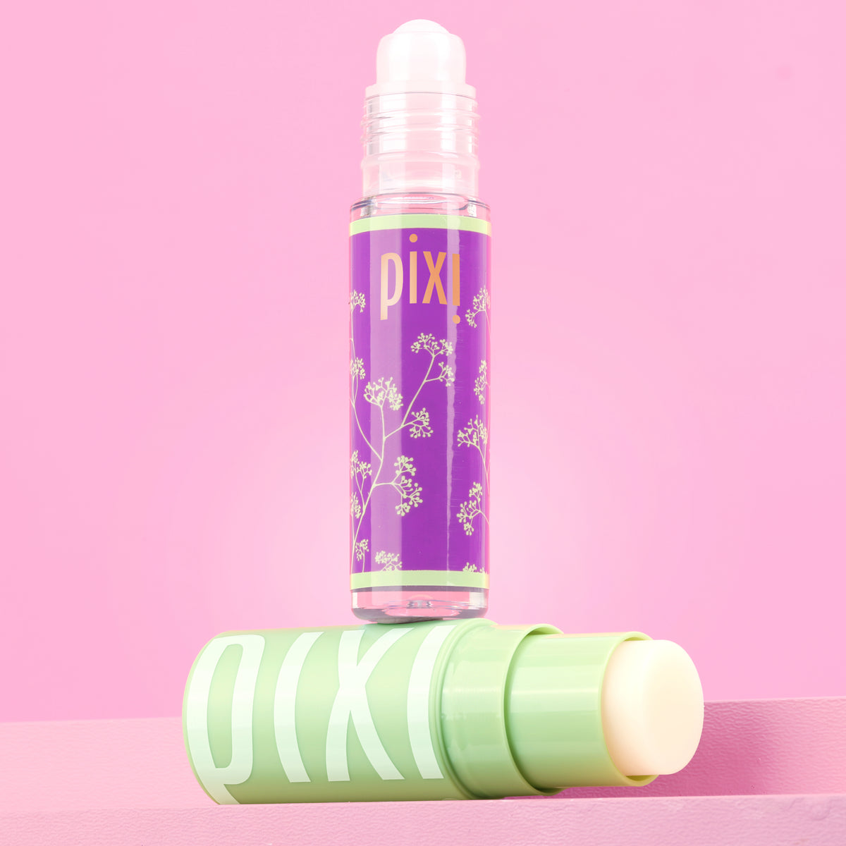 Petra's Overnight Reset featuring Glow-y Lip Oil and +Hydra LipTreat on a pink background -