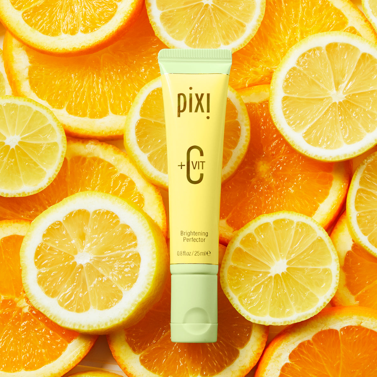 +C Vit Brightening Perfector with a background of oranges