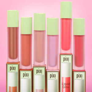 Pixi LiquidGlow with some packaging and green caps on a pink background