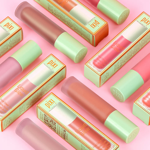 Pixi LiquidGlow and green caps on a pink background view 3