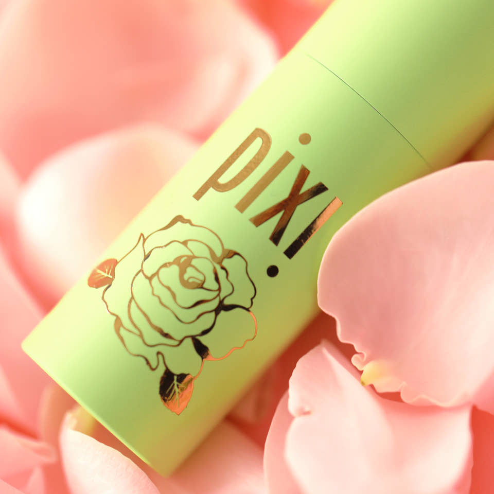 Close up of design detail on PixiRose Perfume showing a rose design on a pink background view 2