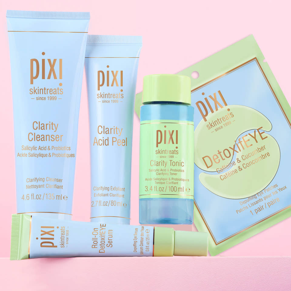 Clear Skin Reset Bundle shown on a pink background featuring Clarity Cleanser, Clarity Acid Peel, Clarity Tonic, Roll-On DetoxifEYE Serum and DetoxifEYE pair of patches - View 1 view 1