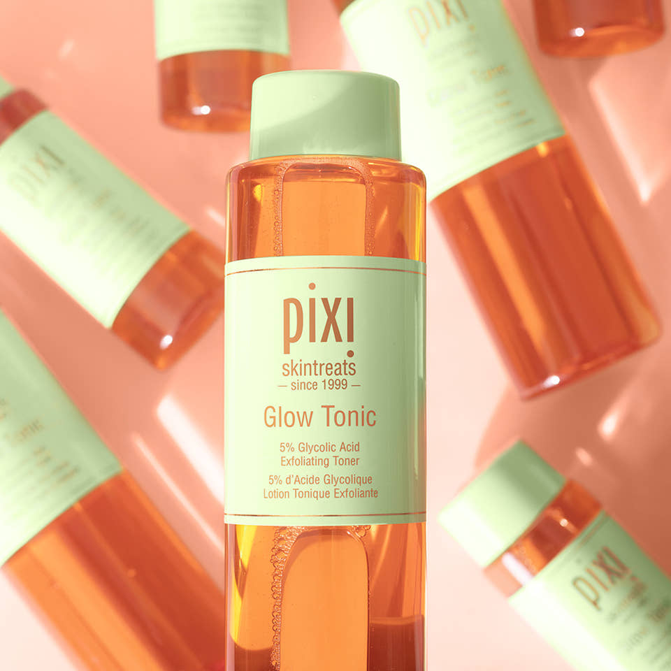 Glow Tonic 250ml product packaging includes several products in the background. view 1